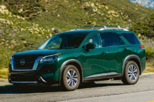 Certified Nissan Mechanic Repairing Green Nissan Pathfinder